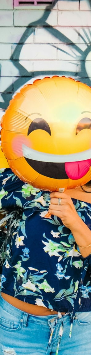 woman holding balloons