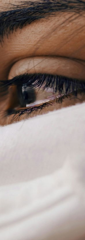 shallow focus of a woman's sad eyes